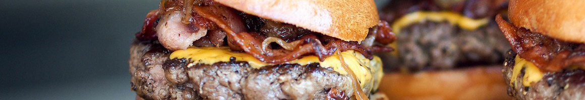Eating Burger at Champ Burger restaurant in Houston, TX.